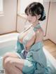 A woman in a blue kimono sitting in a bathtub.