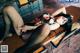 A woman laying on top of a wooden table.